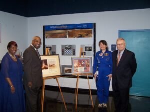 Challenger Learning Center Director Dr. Carolyn Donelan accepts space memorabilia from former USC President James B. Holderman. Holderman was given the pieces by NASA Astronauts John W. Young and Robert L. Crippen who received honorary degrees during USC Commencement May 16, 1981.
Pictured (left to right) are Dr. Debra Brathwaite, Deputy Superintendent of Richland County School District One; Dr. Percy Mack, Superintendent of Richland County School District One, Dr. Carolyn Donelan, Lead Flight Director of the Challenger Learning Center of Richland County School District One, and Dr. James Holderman, former President of the University of South Carolina.