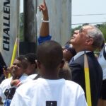 People view a model rocket launch.